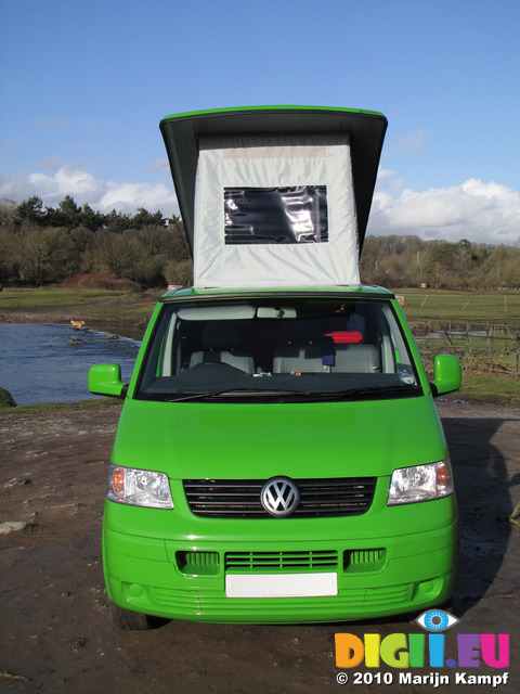 SX12381 Our green VW T5 campervan with popup roof up at Ogmore Castle